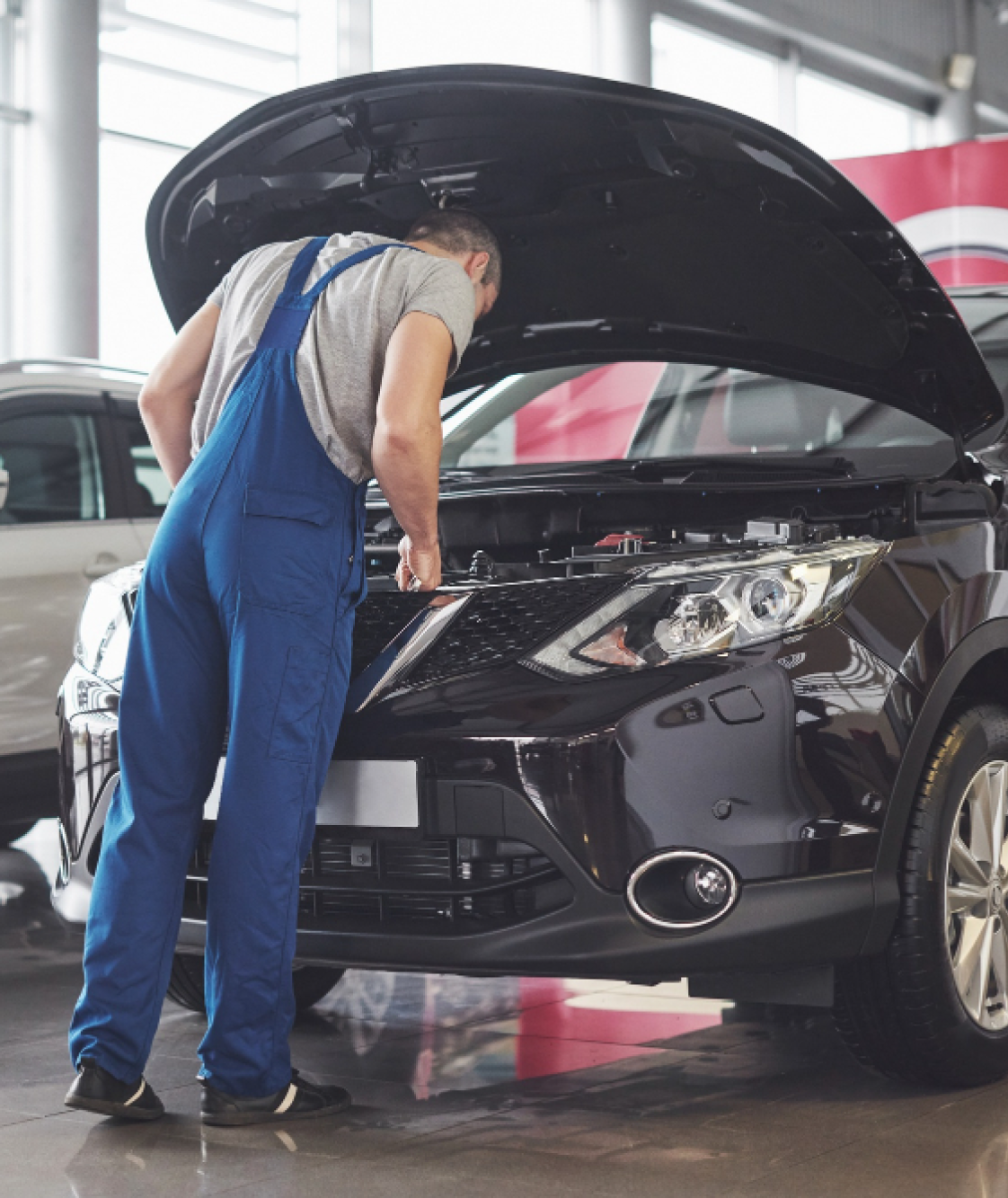 Mechanic working under the hood of a car