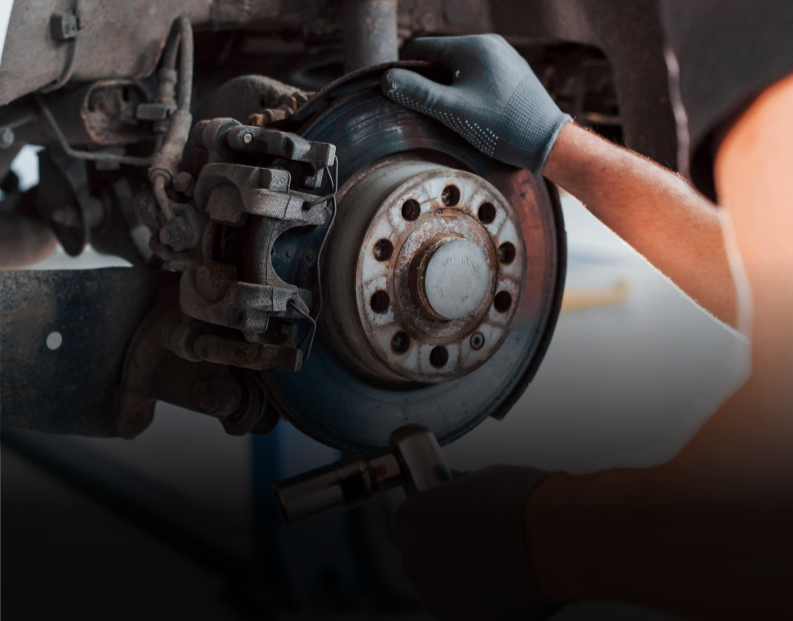 Mechanic inspecting a brake rotor