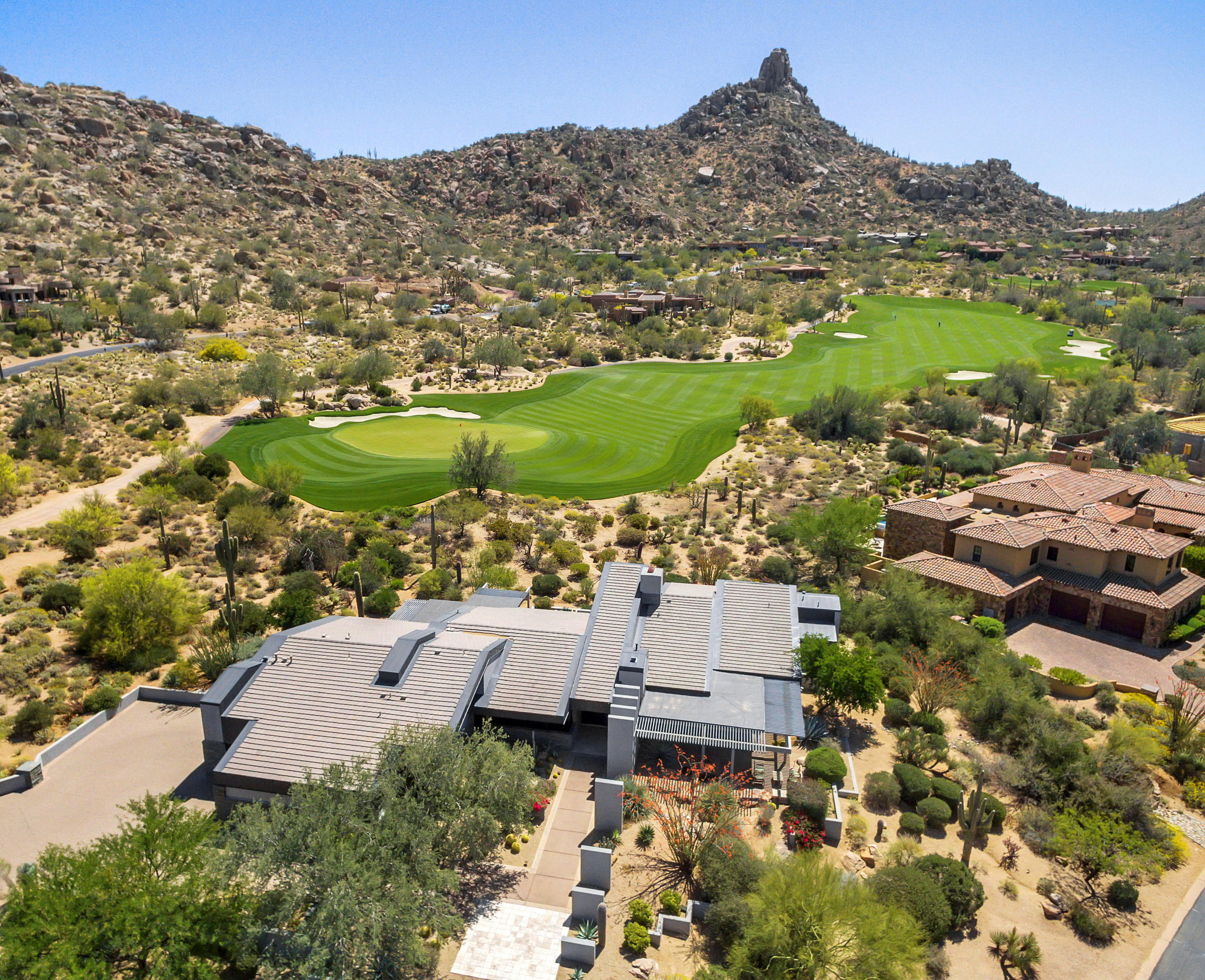 An Arizona neighborhood surrounded by desert landscaping and golf course greenery
